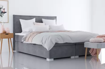 Eleganckie tapicerowane łóżko kontynentalne do sypialni CAMEL z pojemnikiem na pościel. Obniżka ceny!